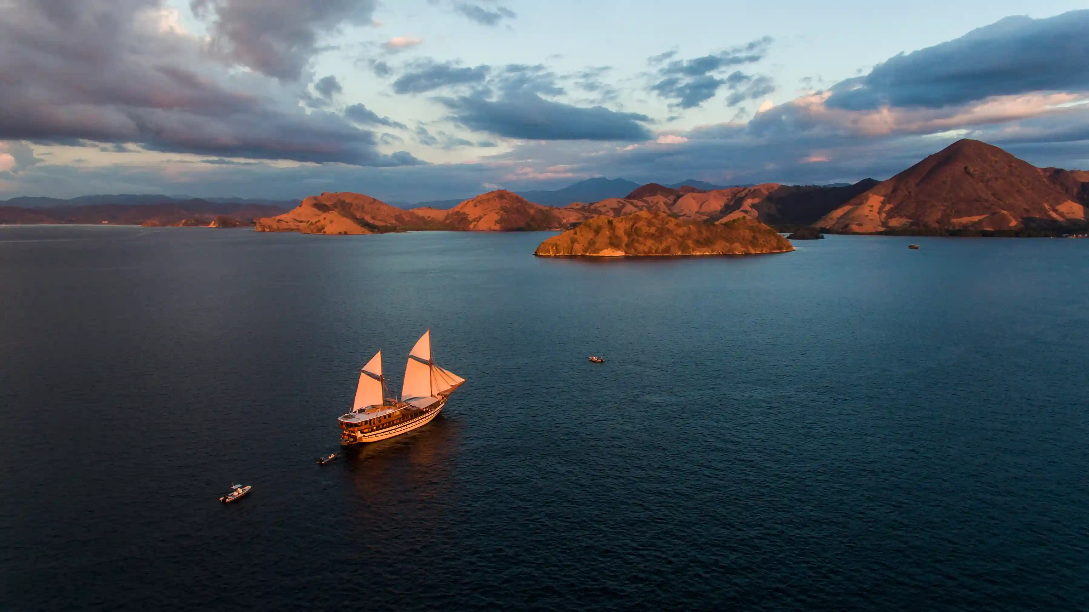 Liveaboard boat anchored near Komodo islands, drone view
